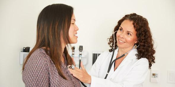 A doctor examining a patient with a stethoscope